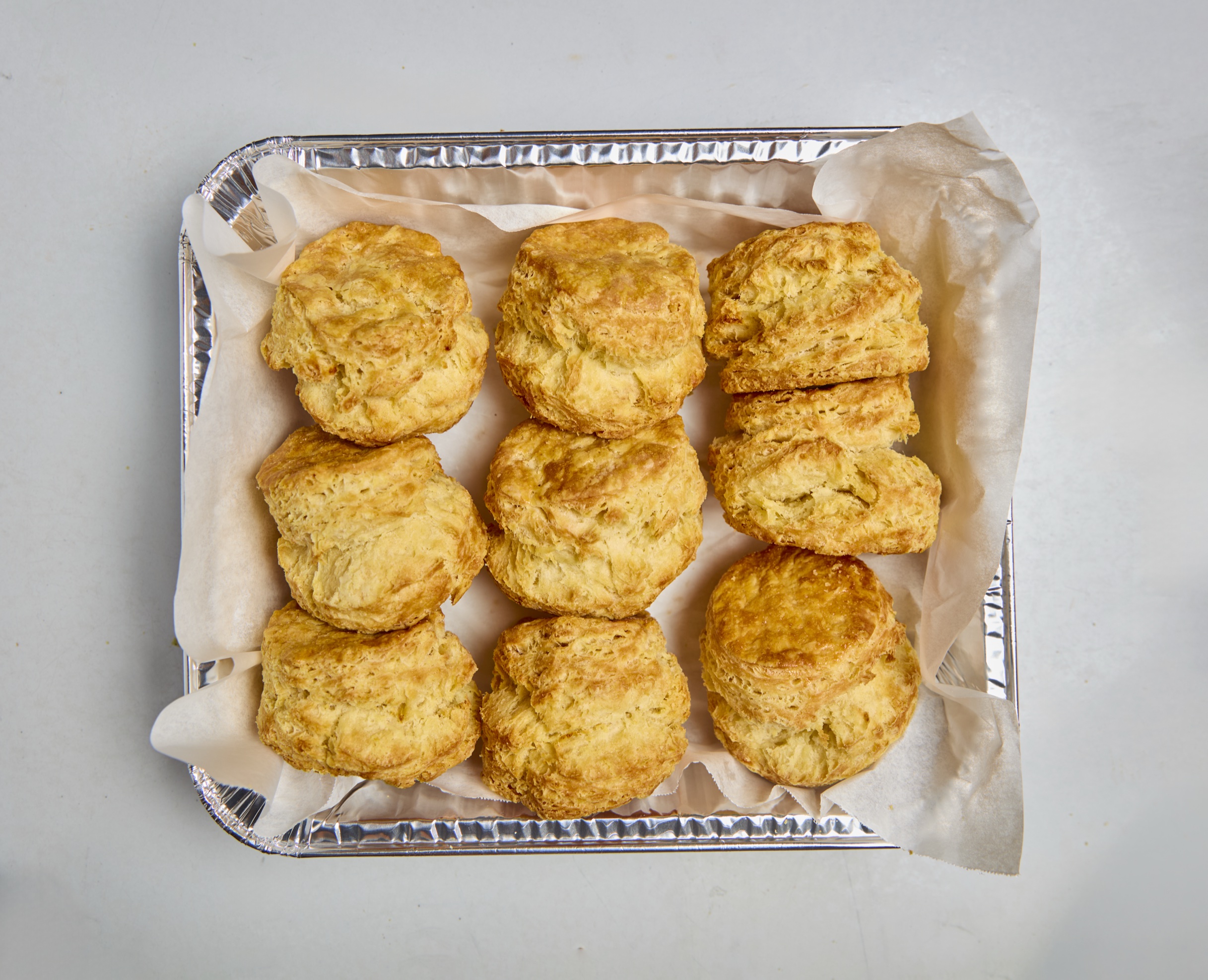 Dozen biscuits with honey butter