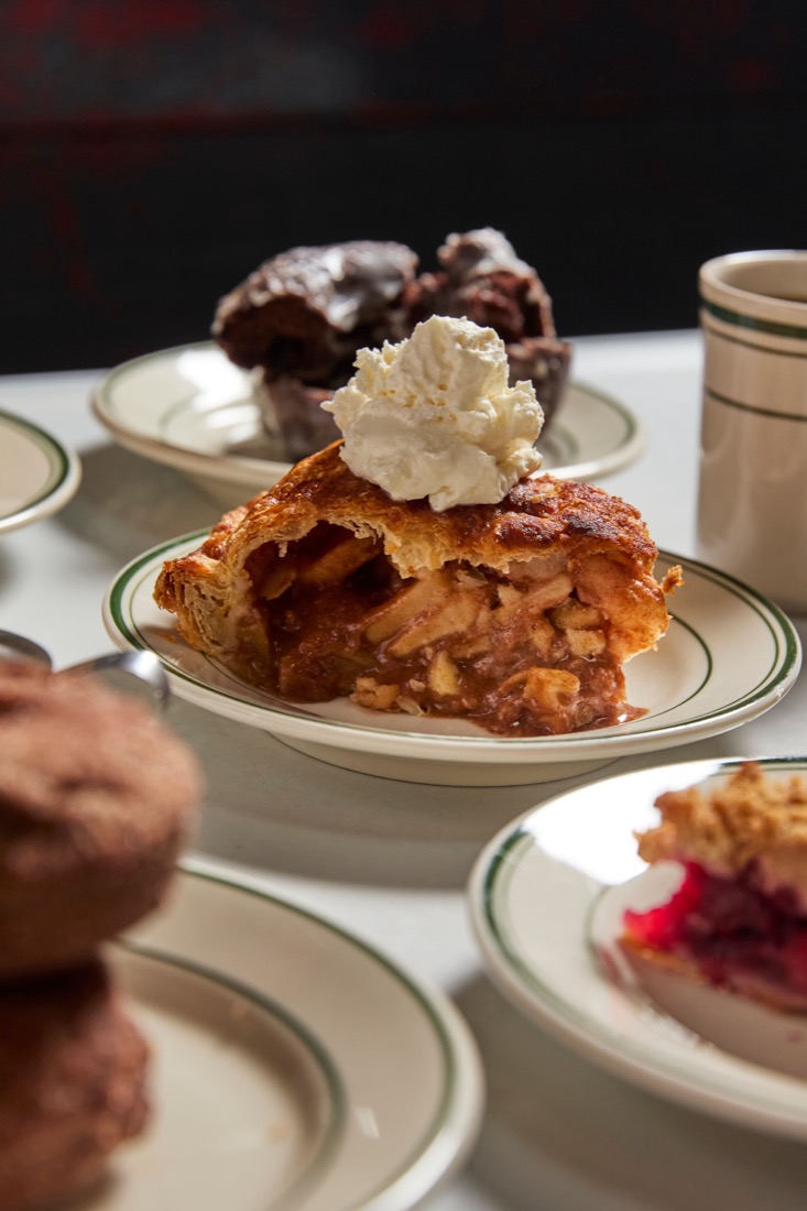 A fresh whole pie topped with cream